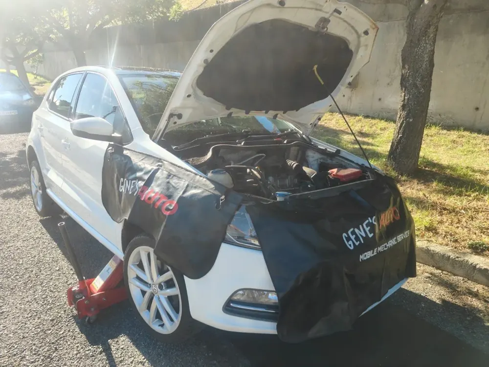 A VW Polo being serviced outdoors